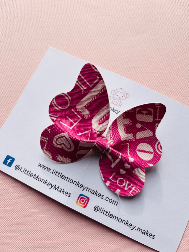 Pink butterfly bow